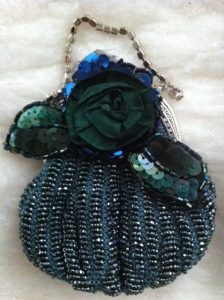 Vintage handknit purse with seedbeads and perle cotton by April Lewis embellished with floor and strap by Martha Lewis